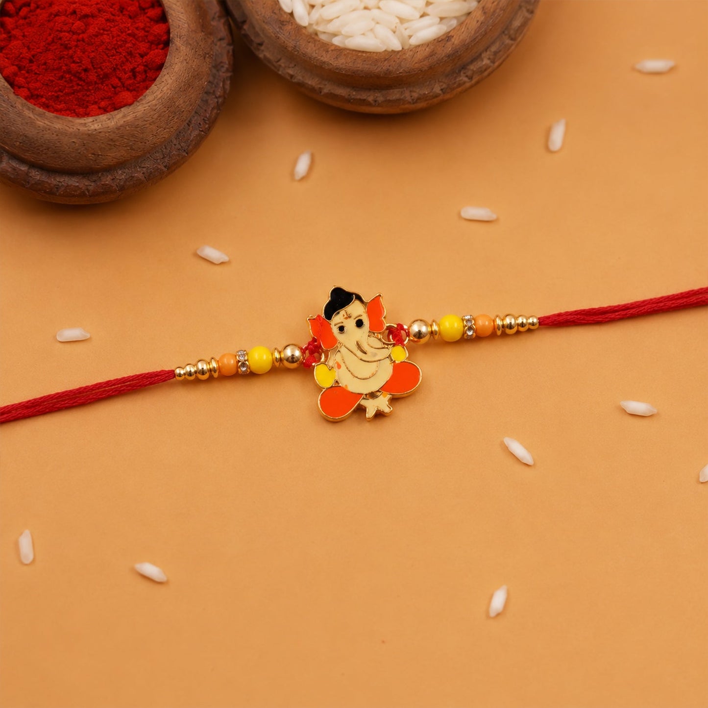 Side view of Divine Idol charm rakhi with decorative beads