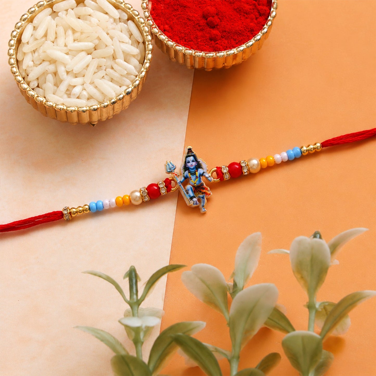 Traditional stylish rakhi featuring Mahadev charm and colorful beads