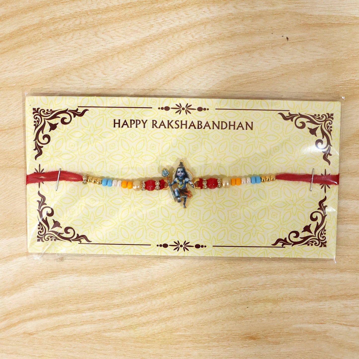 Premium rakhi with Mahadev idol and bead details close up