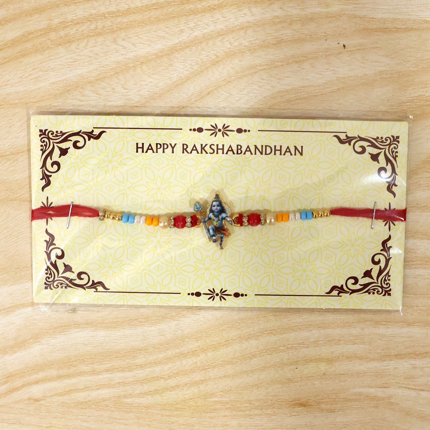 Premium rakhi with Mahadev idol and bead details close up