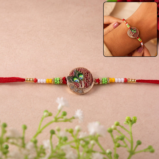 Peacock feather round charm beaded rakhi on white background