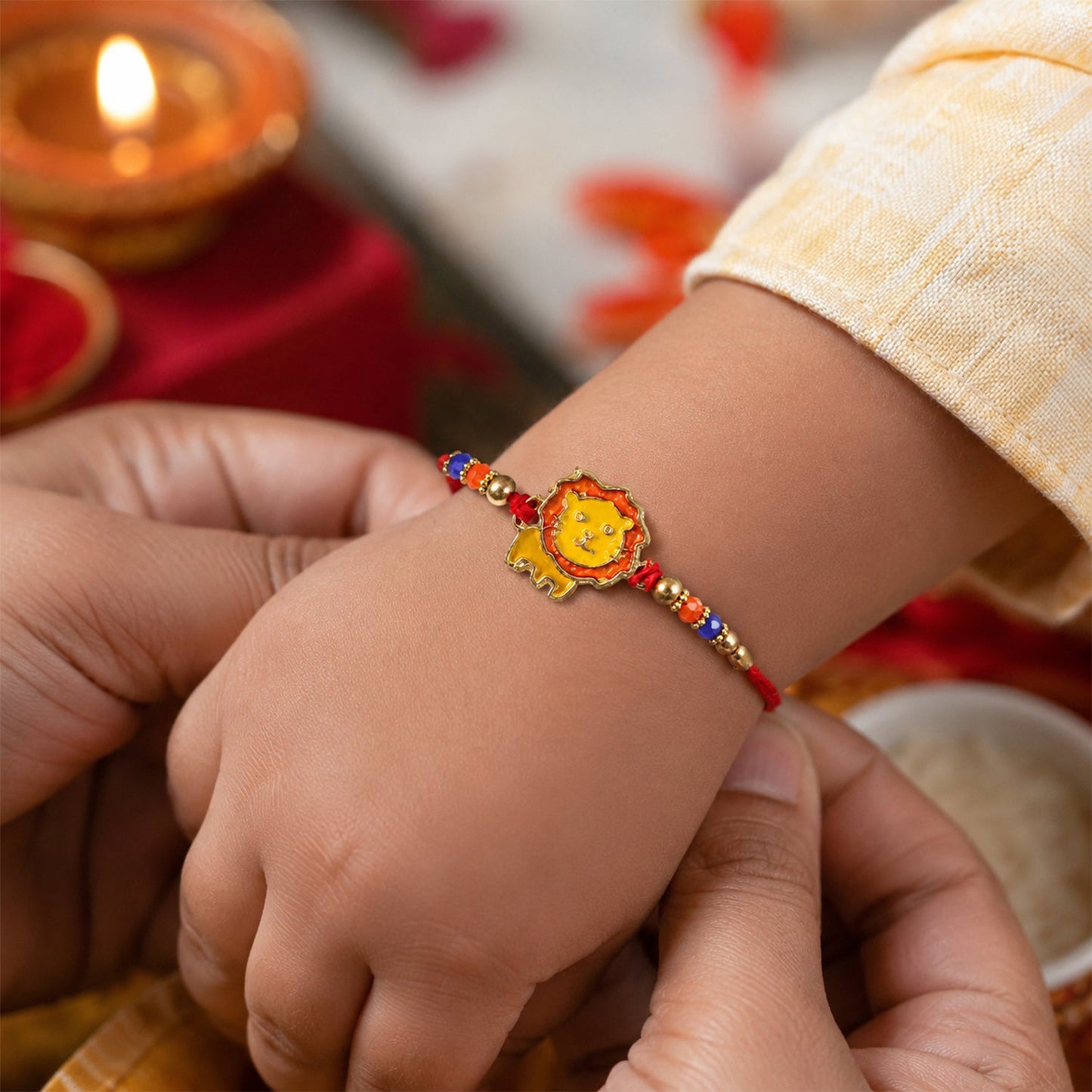 Close-up of lion charm and colorful beads rakhi