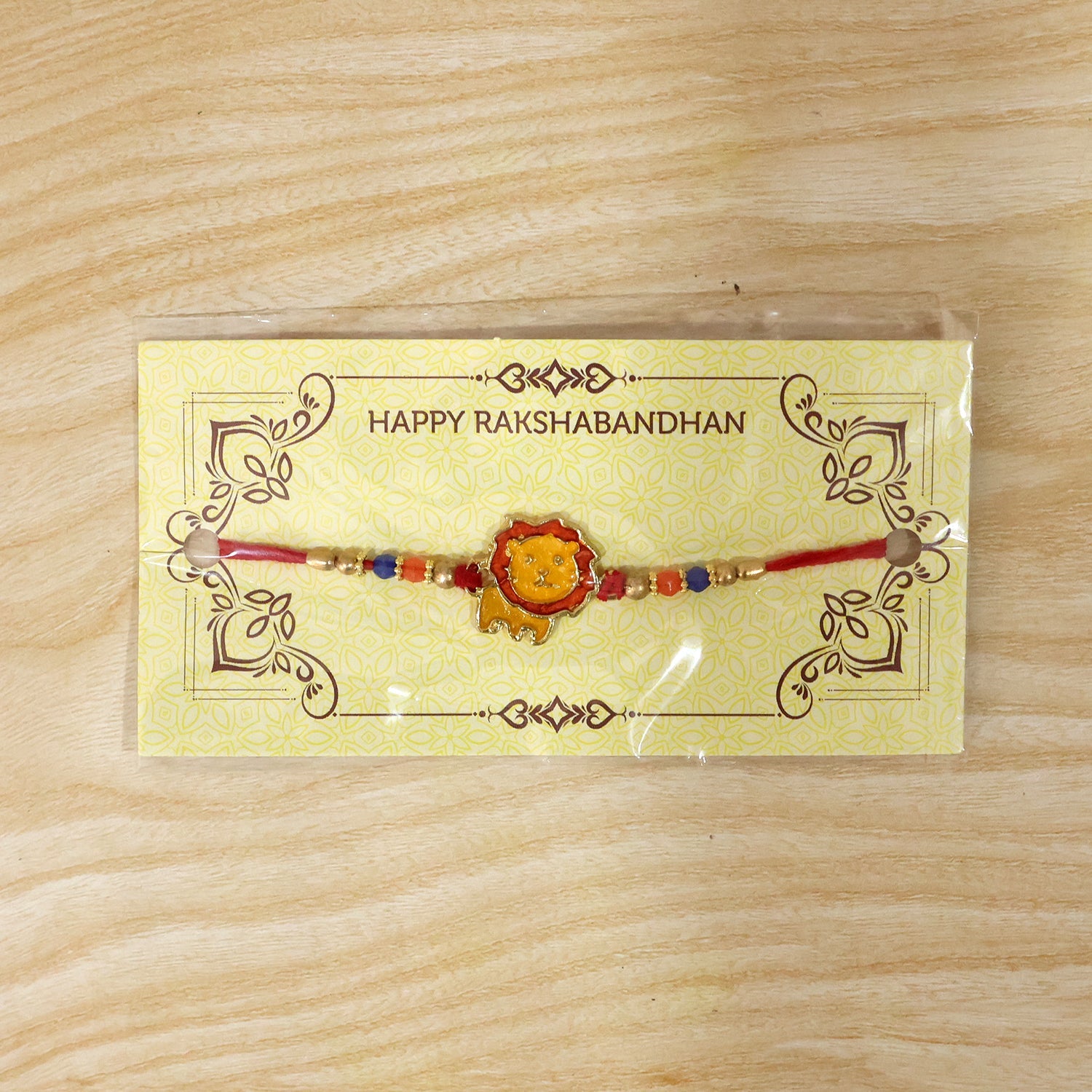 Detailed shot of lion bead rakhi design and thread