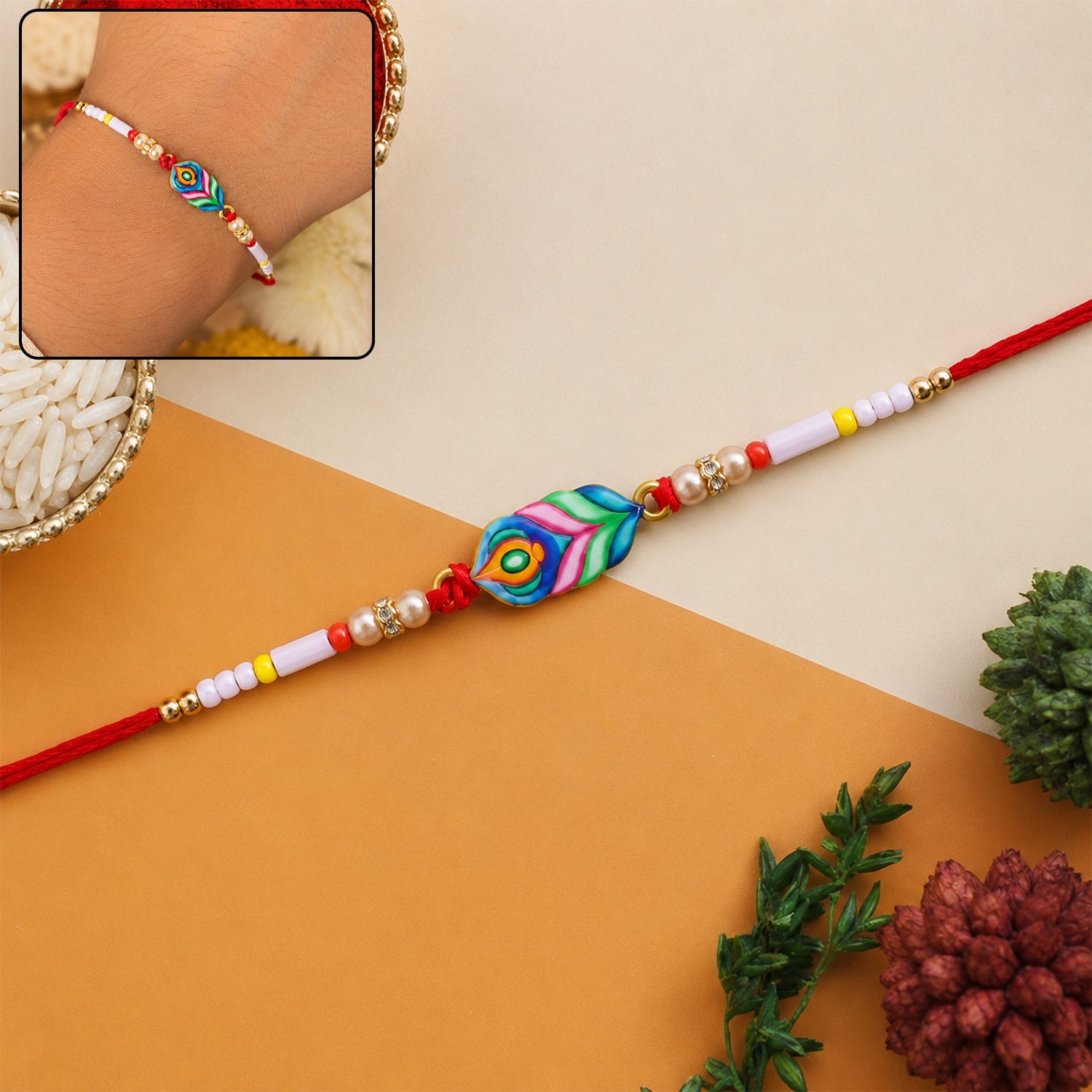 Colorful Mor Pankh charm beaded rakhi on white background