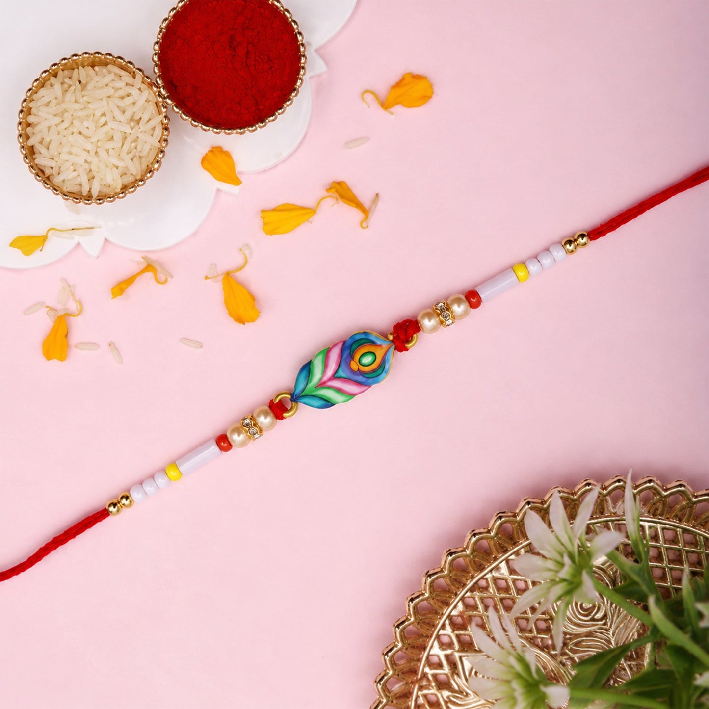 Side view of colorful Mor Pankh beaded rakhi