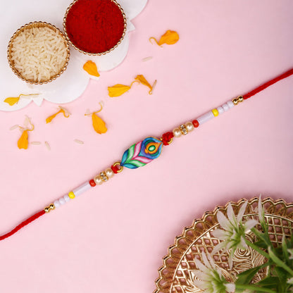Side view of colorful Mor Pankh beaded rakhi