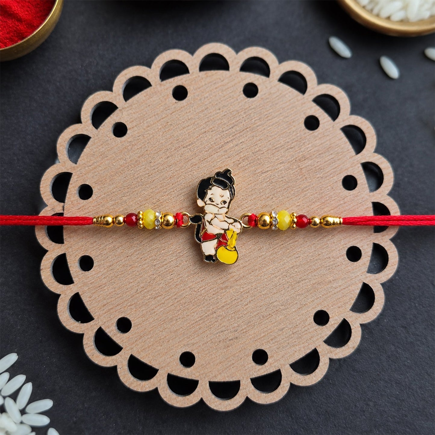 Bal Hanuman with Gada charm rakhi on white background