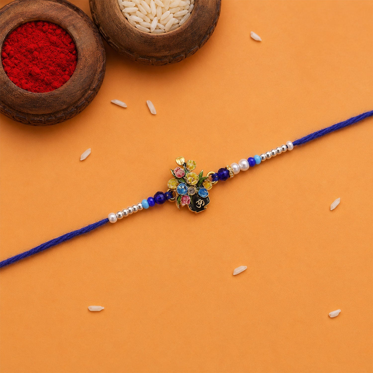 Om Flower Bouquet Meena Charm With Beads Rakhi for Brother (1 Pc)