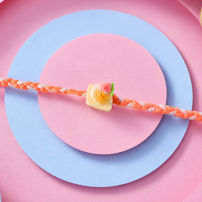 Cute Strawberry Biscuit Charm Braided Thread Kids Rakhi for Brother (1 Pc)
