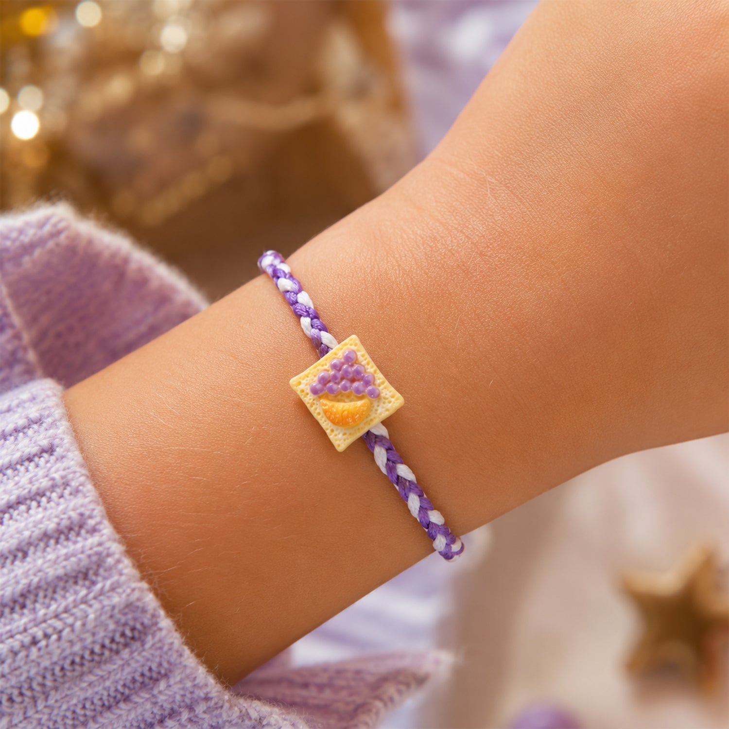 Fruit Toast Charm Braided Thread Rakhi tied and displayed