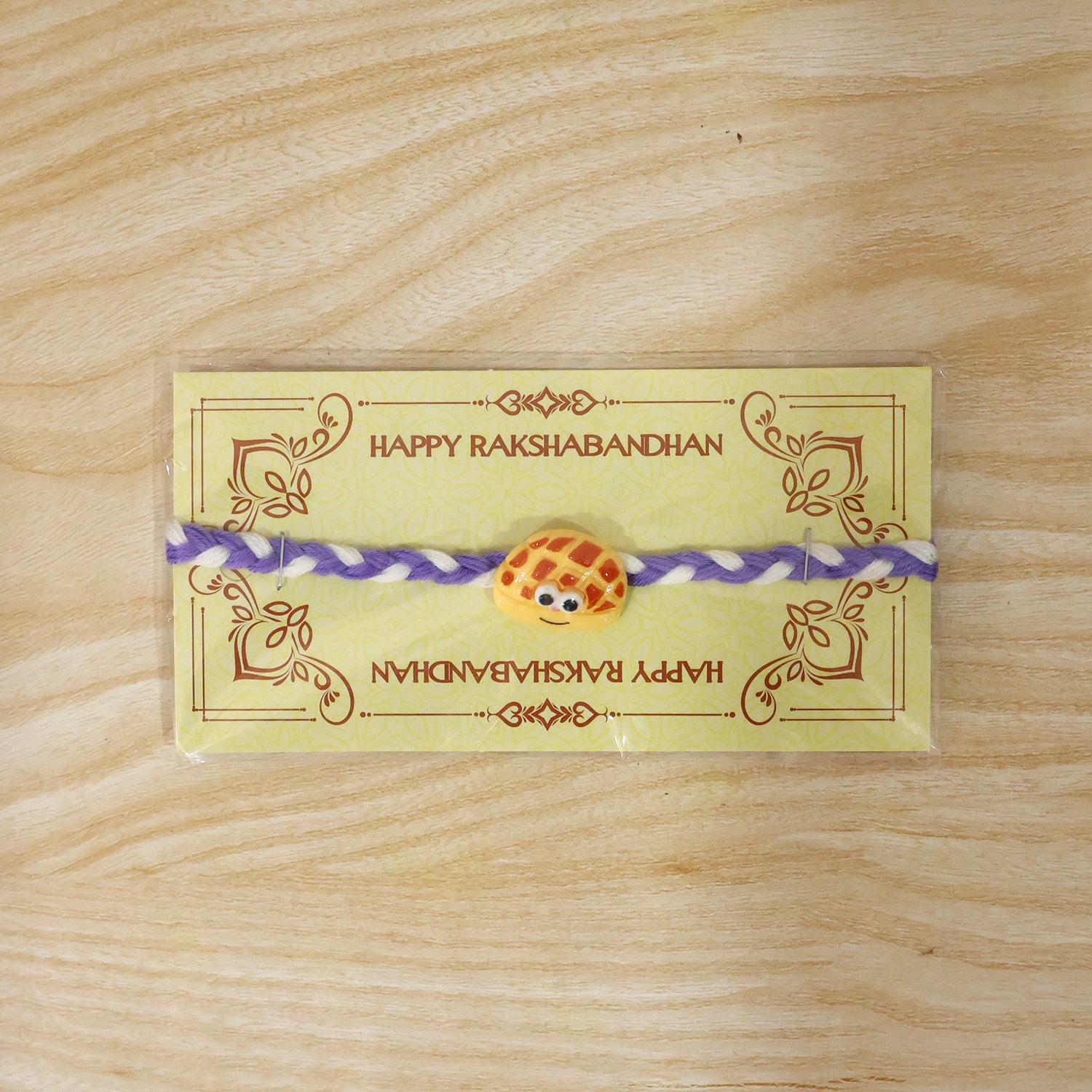 Smiley Waffle Charm Braided Thread Rakhi angle view