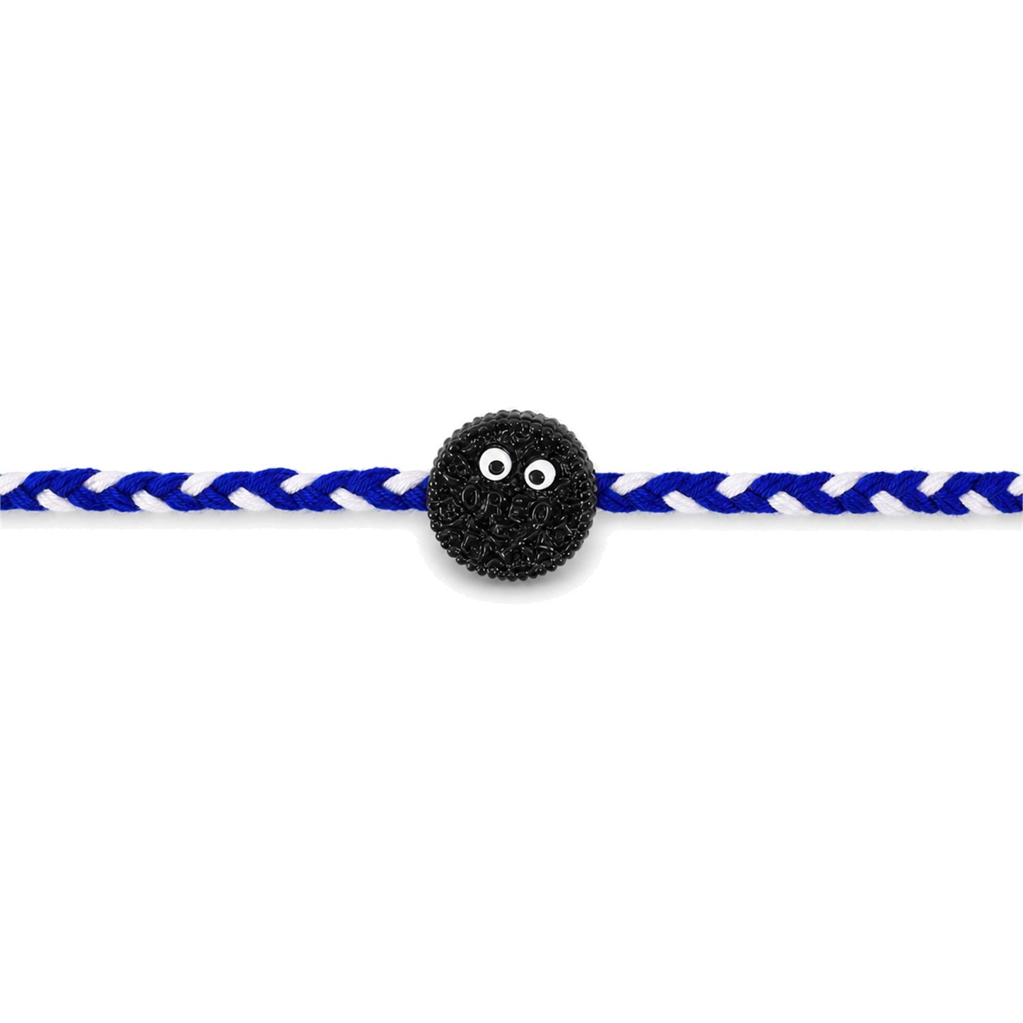 Close-up of braided rakhi with funny cookie eyes charm