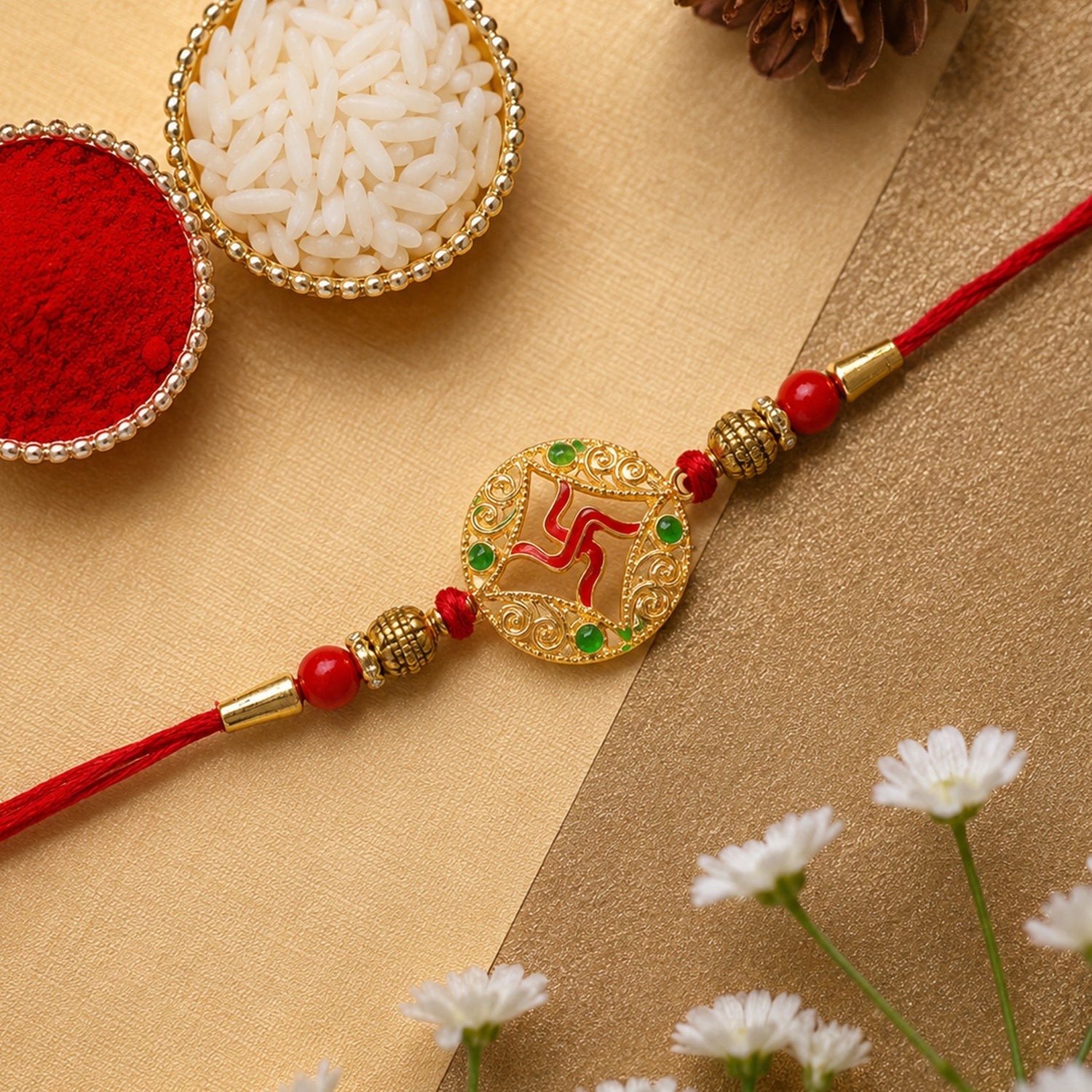 Designer beaded rakhi with golden swastik charm seen from side angle