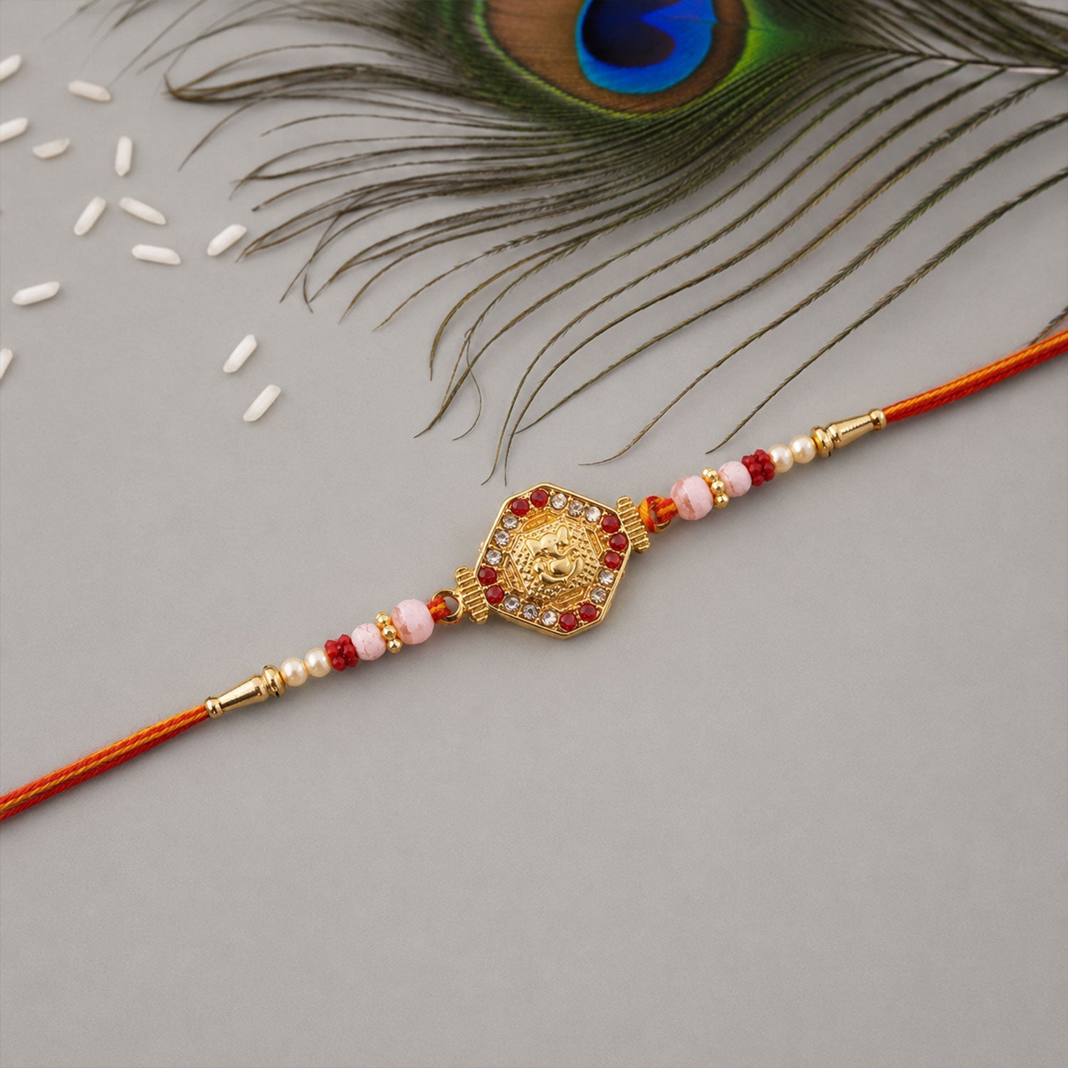 Side view of Ganesh Hexagon Stone Charm Rakhi with pearls