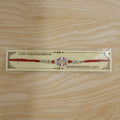 Rakhi – Stylish Silver Swastik Meena Charm for Rakshabandhan