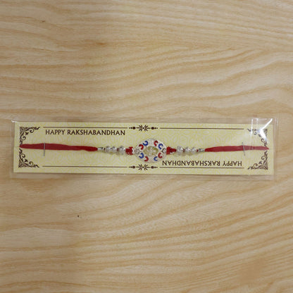Packaging of Silver Swastik Meena Charm Rakhi