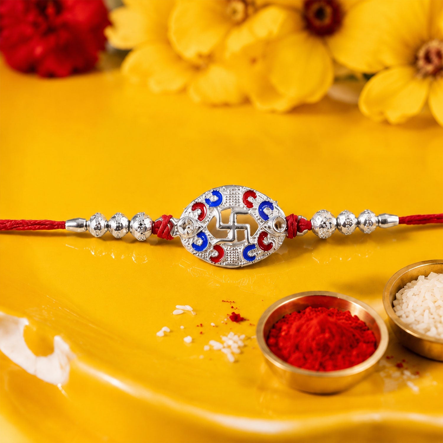 Close-up of swastik charm detail on rakhi