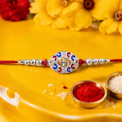 Close-up of swastik charm detail on rakhi