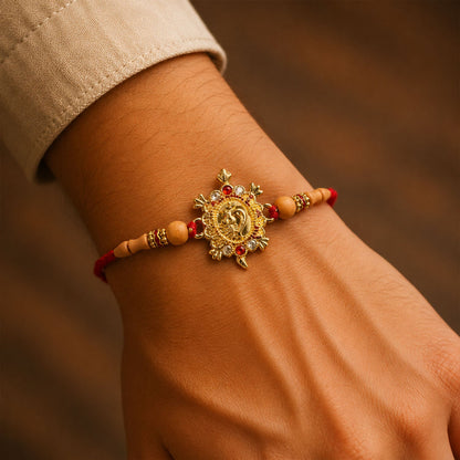 Close-up of Turtle Peacock charm rakhi detail