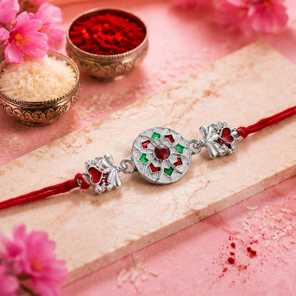 Close-up of Silver Chakra Meena Heart Rakhi showing charm details