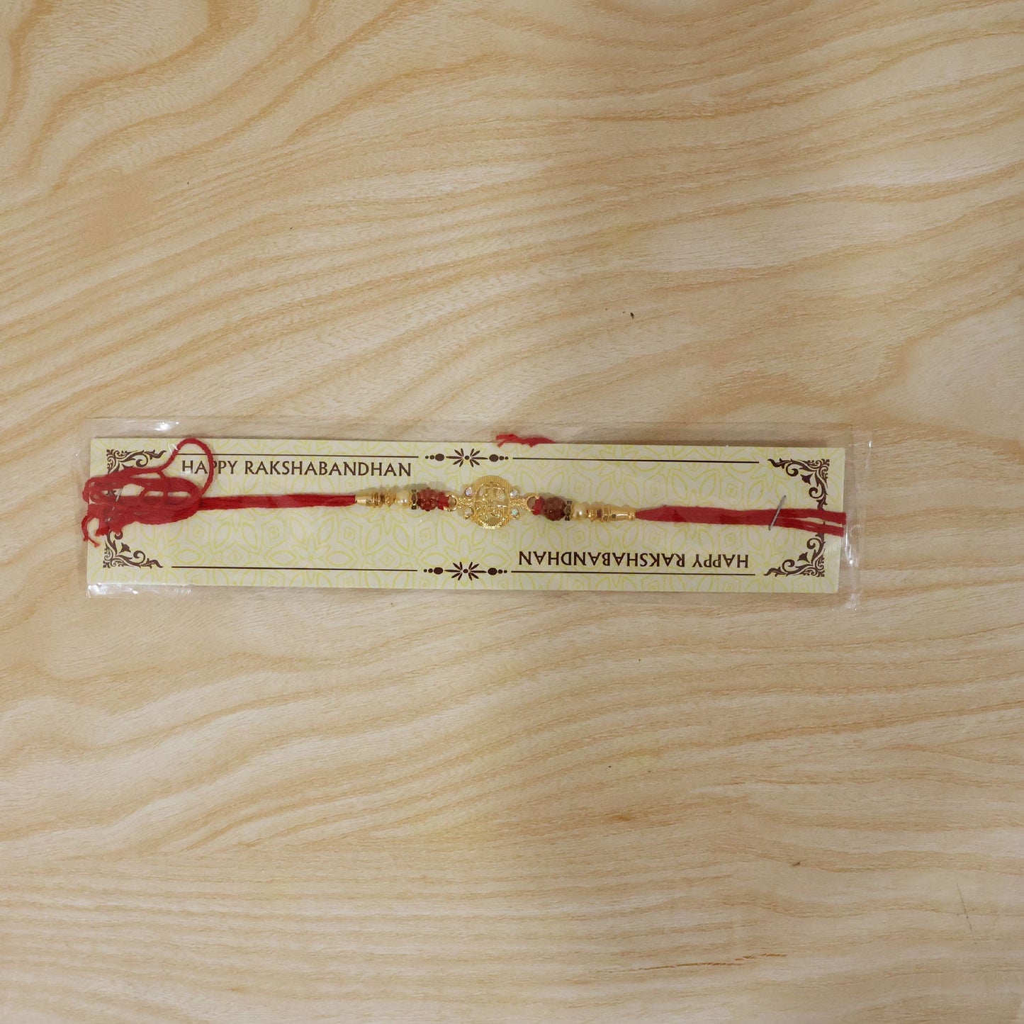 Rakhi laid flat showing full design