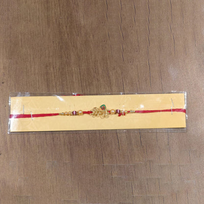 Full view of Krishna Mor Pankh Pearl Beads Rakhi with tying thread