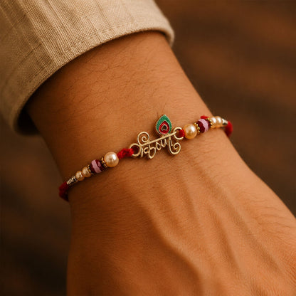 Top angle view of Krishna Mor Pankh Pearl Beads Rakhi