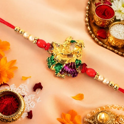 Close-up of Radha Krishna Meena Charm Rakhi with beads