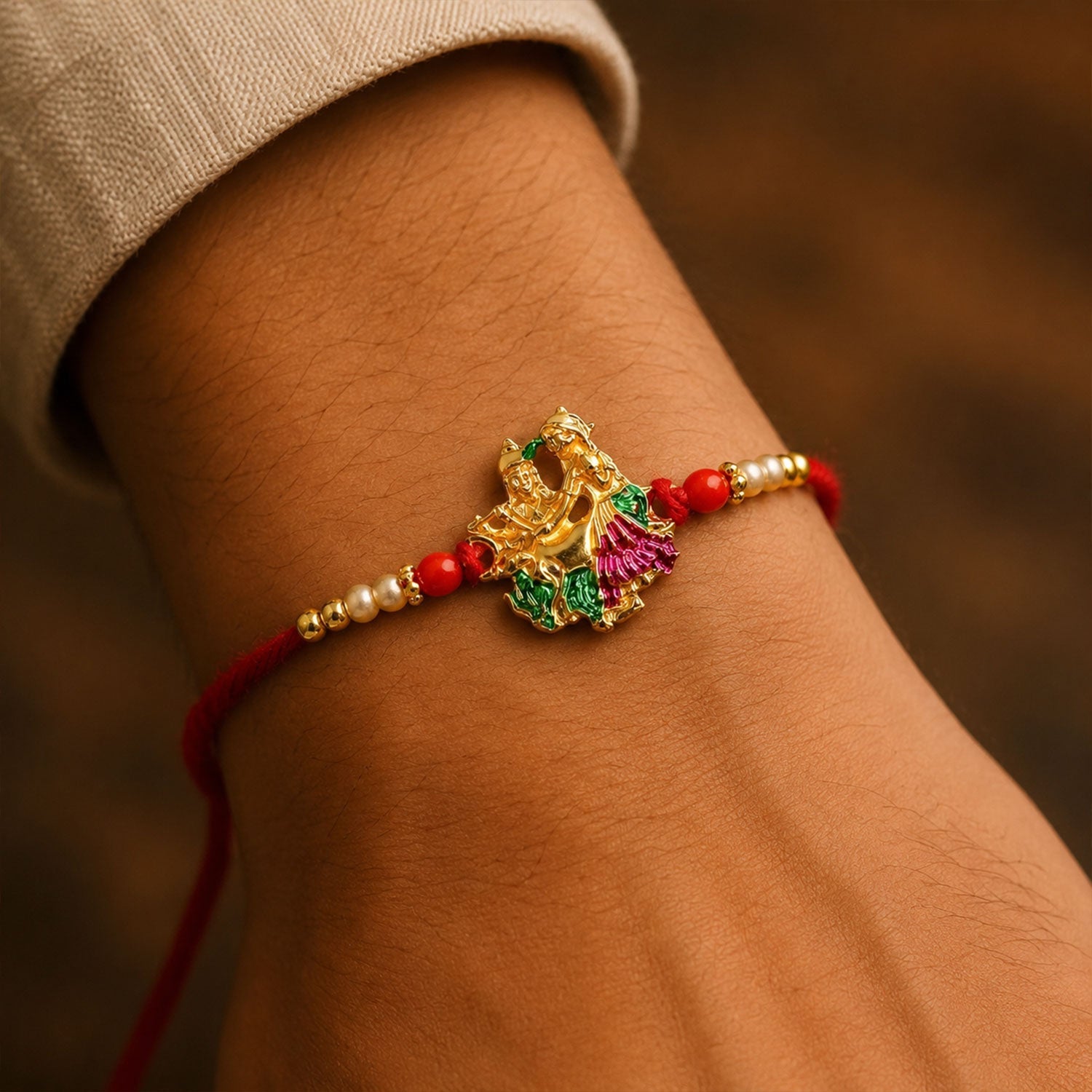 Side angle showing Radha Krishna Meena rakhi charm and beads