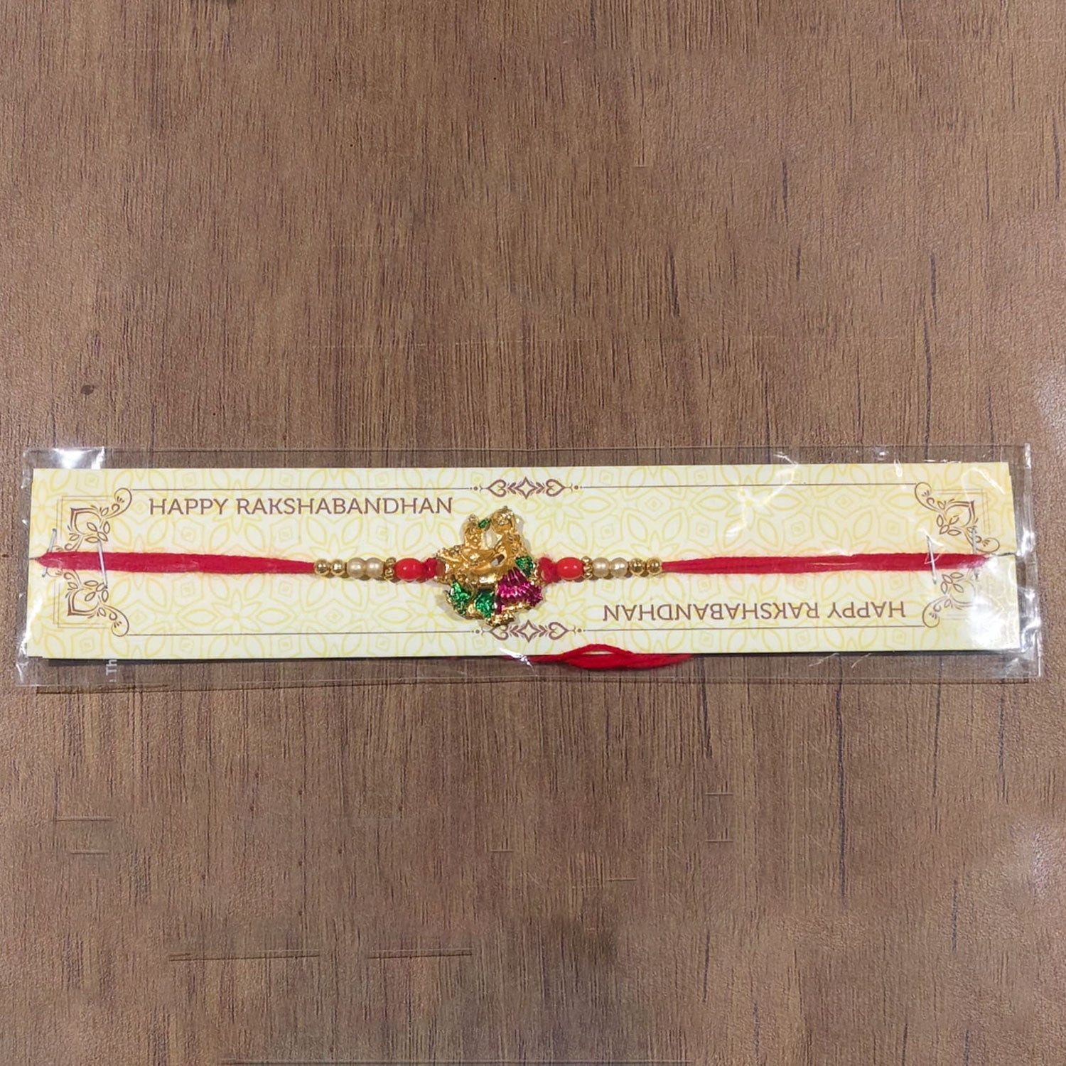 Radha Krishna Meena Beads rakhi with intricate charm design