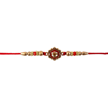Antique Shivling Floral Rakhi displayed on fabric