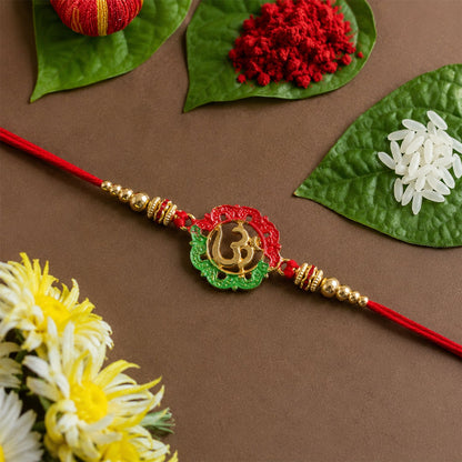 Side view of golden Om charm rakhi with beads