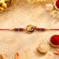 Rakhi – Elegant Golden Mor Feather Charm with Beads for Brothers