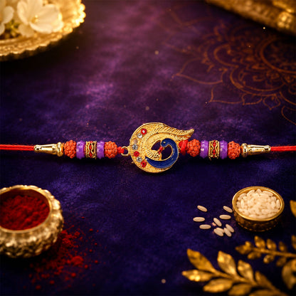 Designer Rakhi with beads and feather on white background