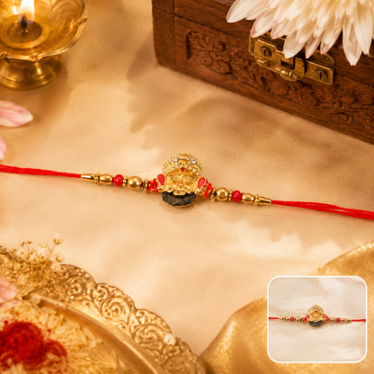 Golden Divine Face Charm Rakhi with Pearl Beads - front view