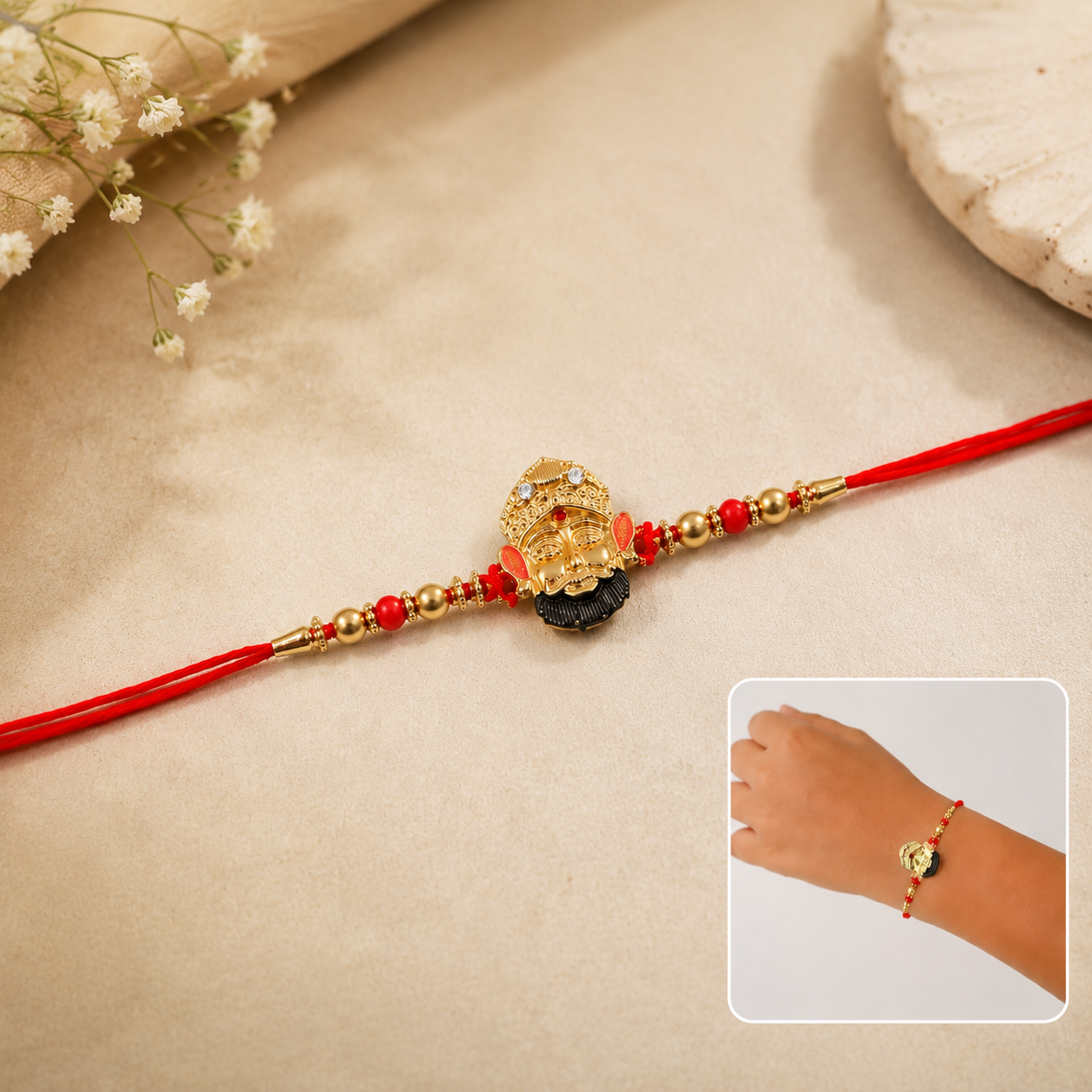 Close-up of pearl bead details on Golden Divine Face Charm Rakhi