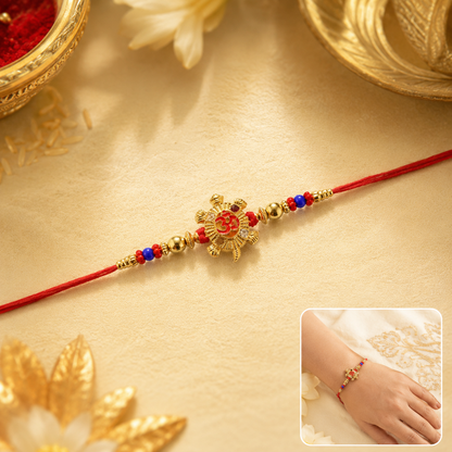 Golden Tortoise Om Meena charm rakhi with beads front view