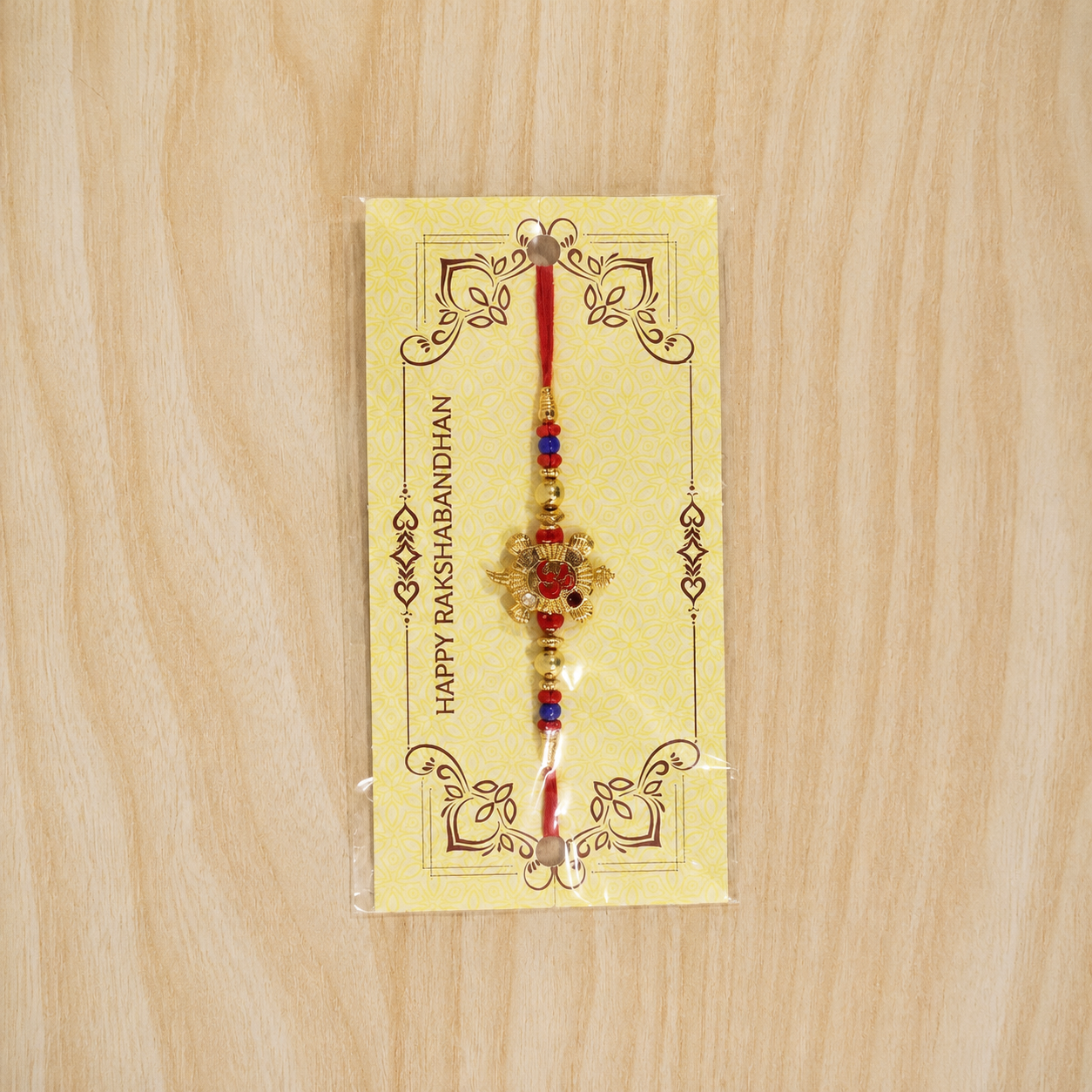 Full length Golden Tortoise Om Meena beaded rakhi string