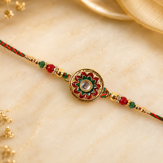 Close-up of golden stone charm rakhi with beads