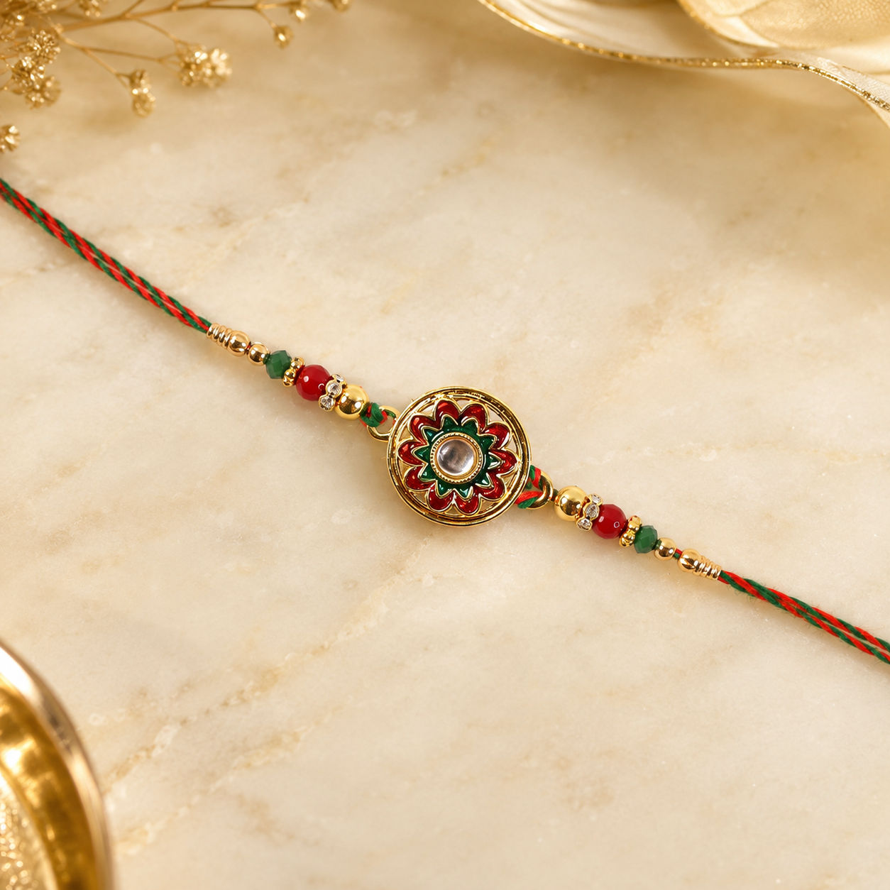 Lightweight rakhi with golden floral stone charm and beads