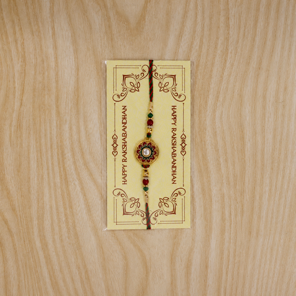 Festive rakhi for brother with golden charm and beads