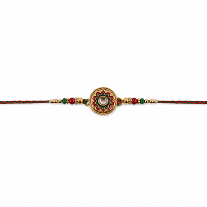 Elegant rakhi displaying round stone charm and beads