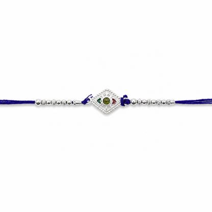 Silver kite shape stone charm Rakhi on white background
