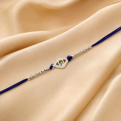 Silver kite shape Rakhi showing stone and beads design
