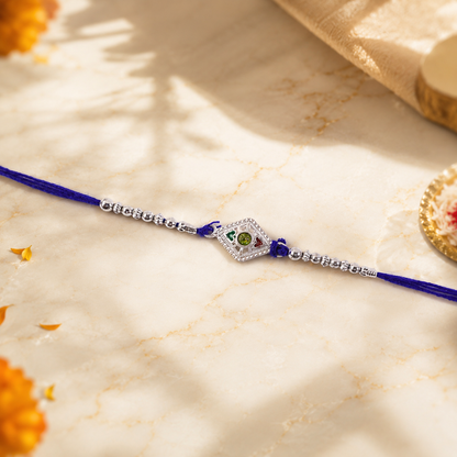 Side view of silver kite stone charm Rakhi with beads