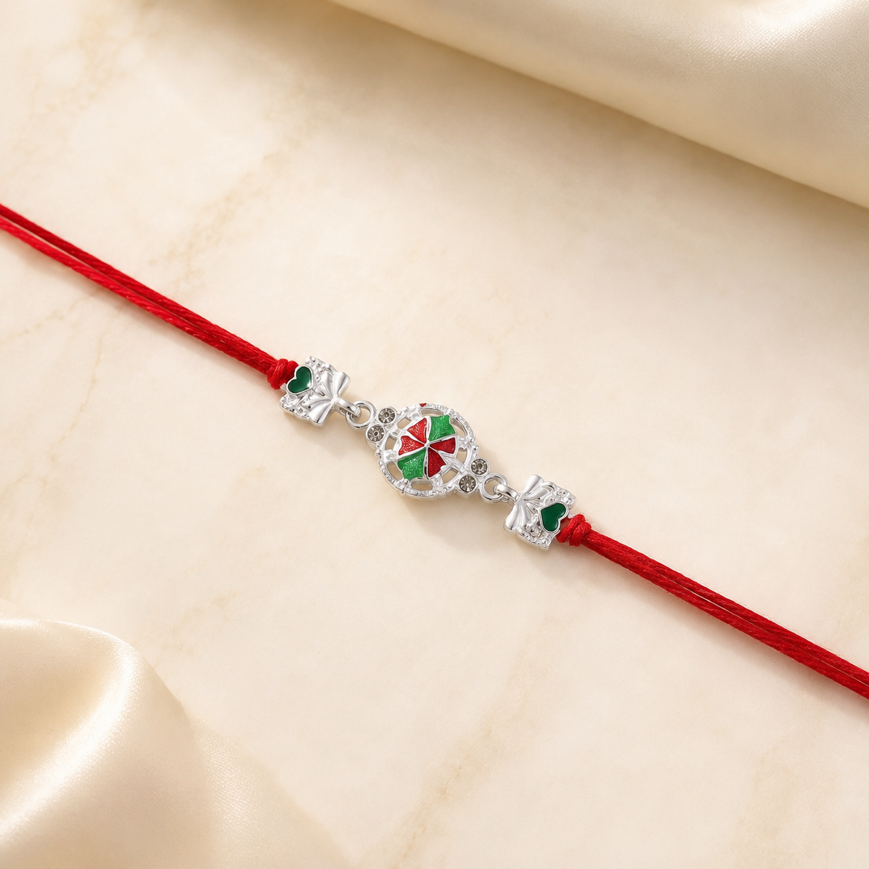 Top view of silver pinwheel flower rakhi with thread