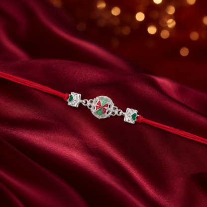 Side angle of silver pinwheel flower charm on rakhi