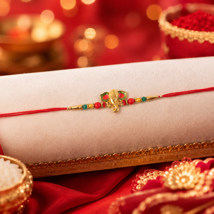 Golden Ganesha charm surrounded by colorful beads on rakhi
