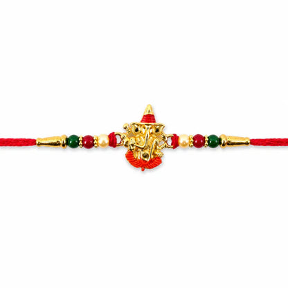 Detailed shot of the Ganesha motif and Meenakari work on the Rakhi.