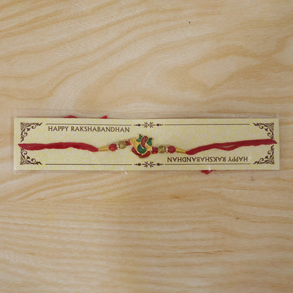 Lord Ganesha Meenakari Rakhi in Red & Green